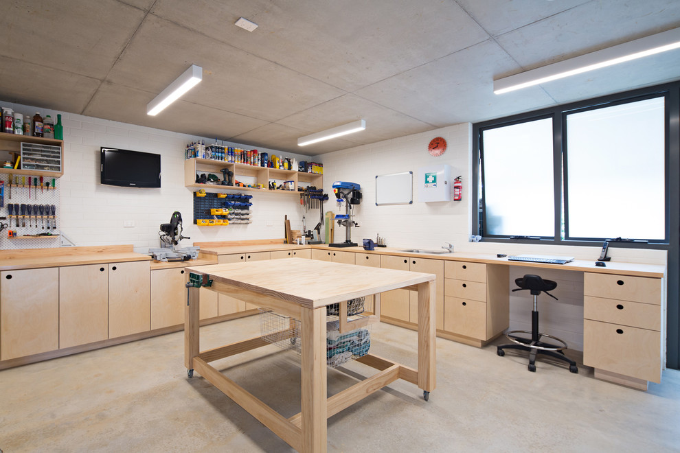 Design ideas for a large contemporary garage workshop in Sydney.