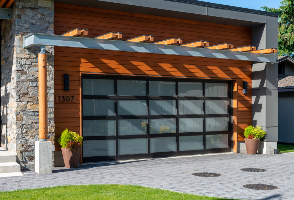 Mid-sized attached two-car garage pergola photo in Seattle