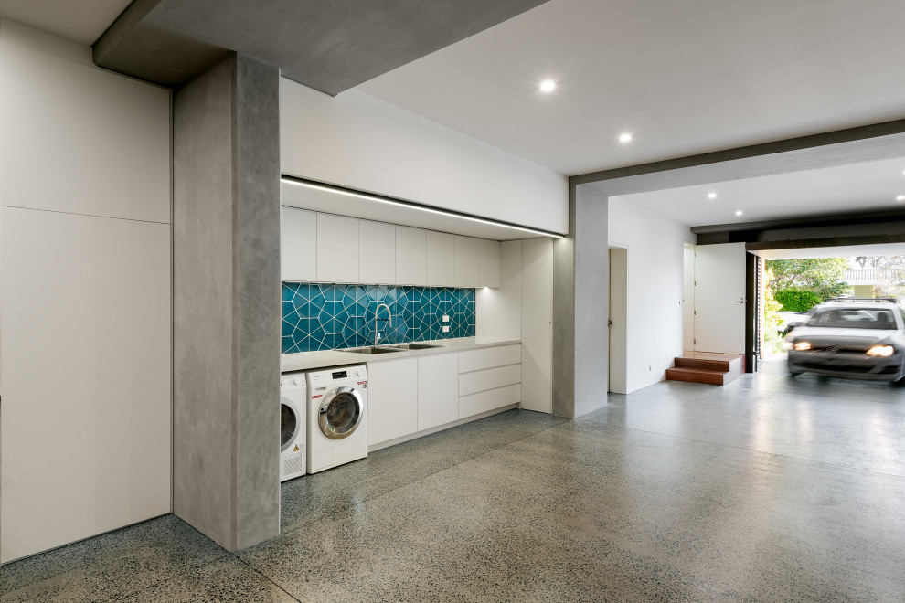 Photo of an expansive contemporary garage in Melbourne.