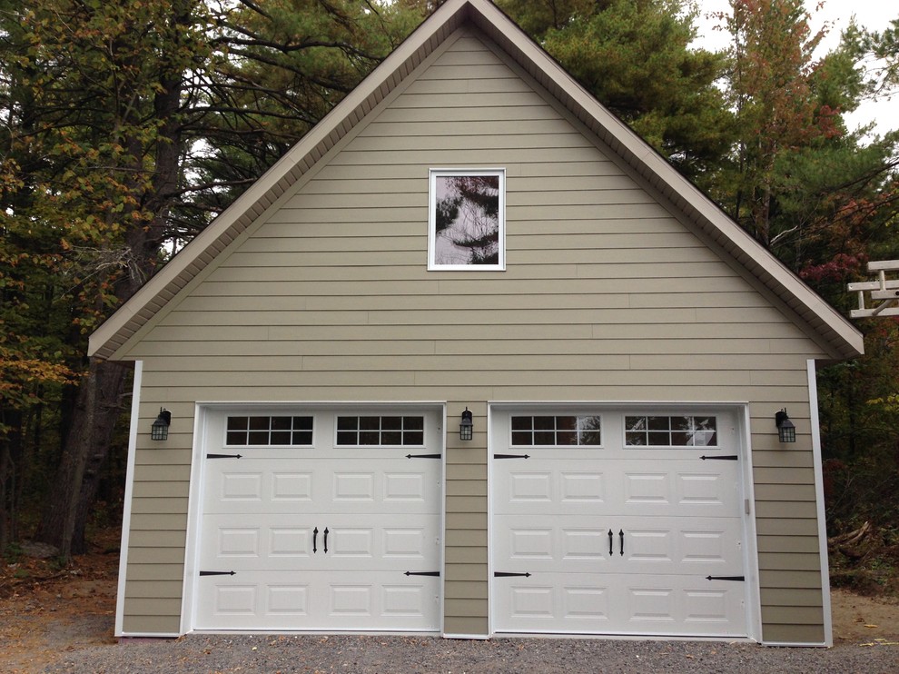 Mid-sized elegant detached two-car garage photo in Ottawa