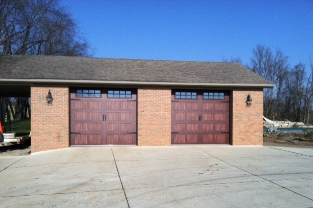 Photo of a large traditional detached double garage in Cleveland.
