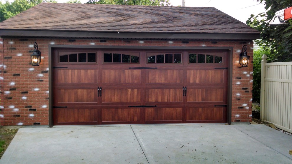 Example of a mid-sized classic detached two-car garage design in Cleveland