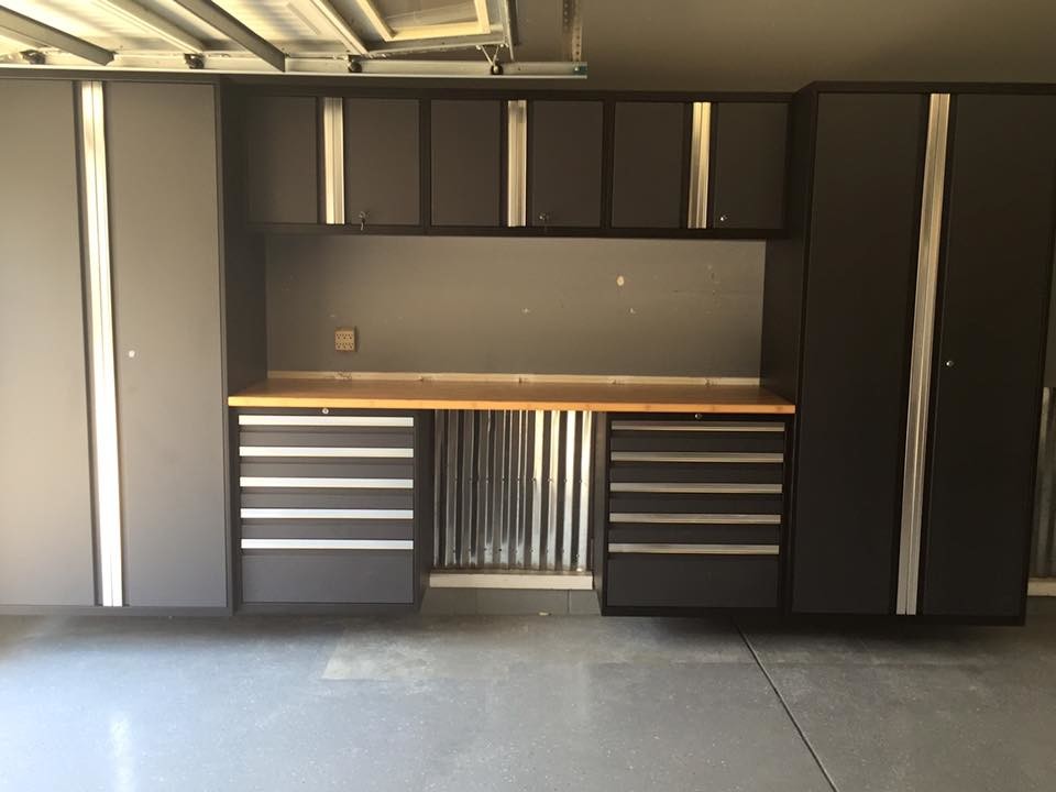 Design ideas for a medium sized modern attached garage in Phoenix.
