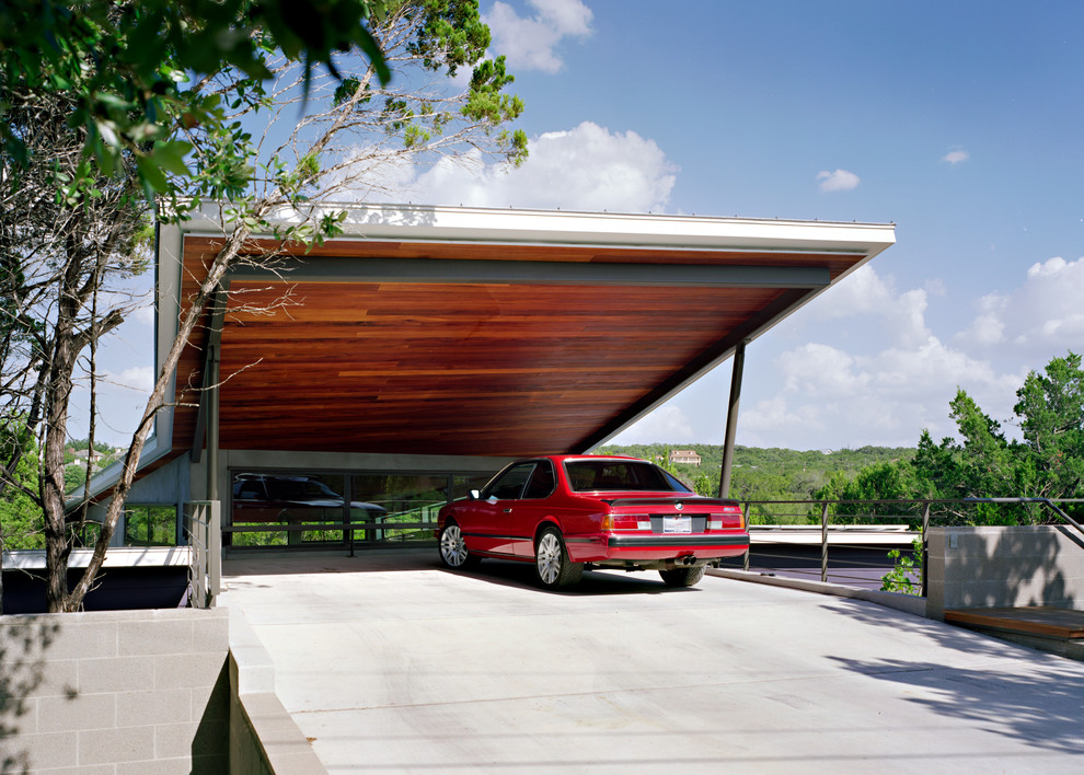 Стильный дизайн: большой пристроенный гараж в современном стиле с навесом для автомобилей для двух машин - последний тренд