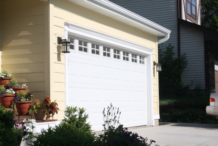 Photo of a medium sized beach style attached double garage in Chicago.