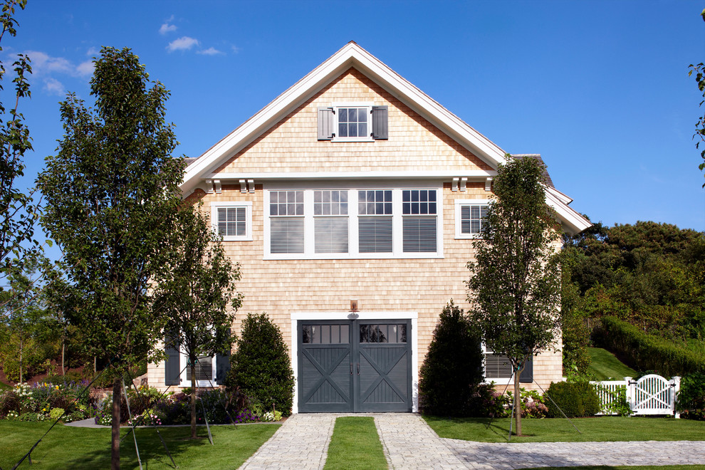 Photo of an expansive nautical detached garage in Boston.