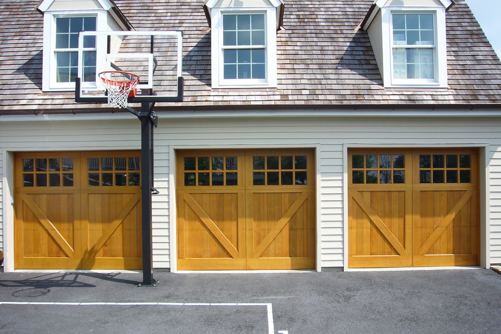 Inspiration for a large timeless detached three-car garage remodel in New York