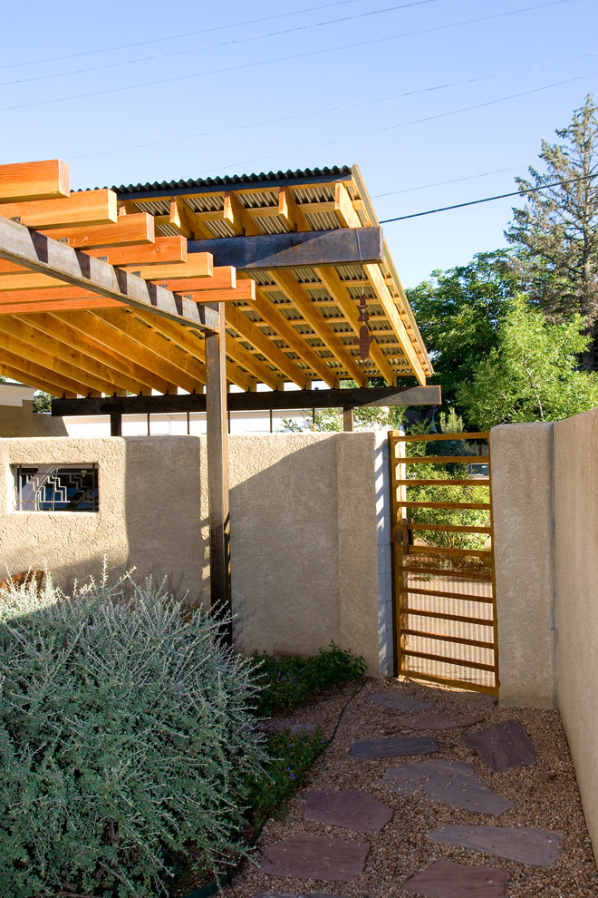 Small transitional detached two-car carport photo in Albuquerque
