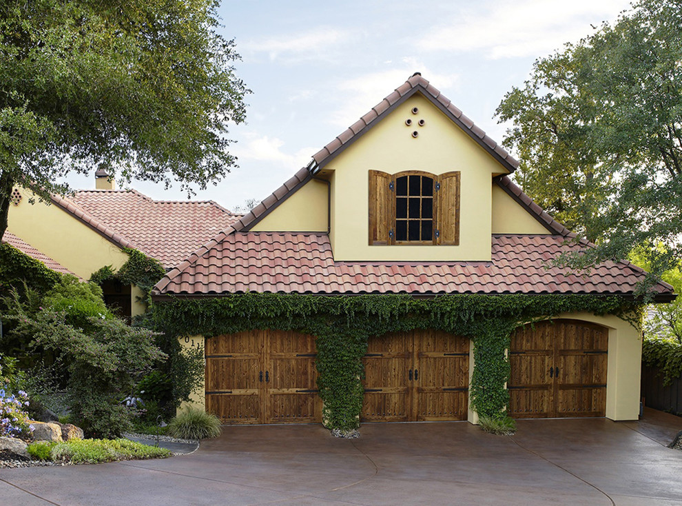 Inspiration for a large timeless attached one-car garage remodel in Los Angeles