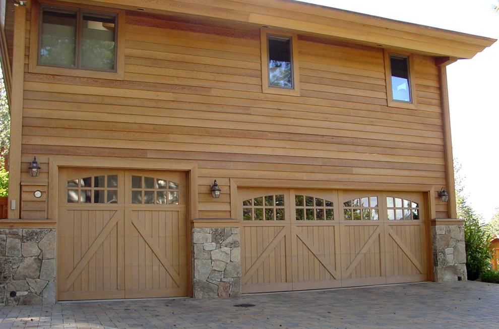 Large mountain style attached one-car garage photo in Los Angeles