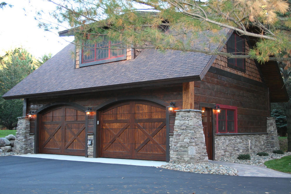 Photo of a large rustic detached garage in Minneapolis with four or more cars.