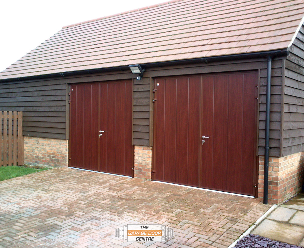 This is an example of a small contemporary detached double garage in Other.
