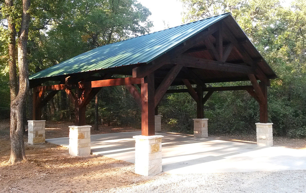Inspiration for a large rustic detached two-car carport remodel in Dallas