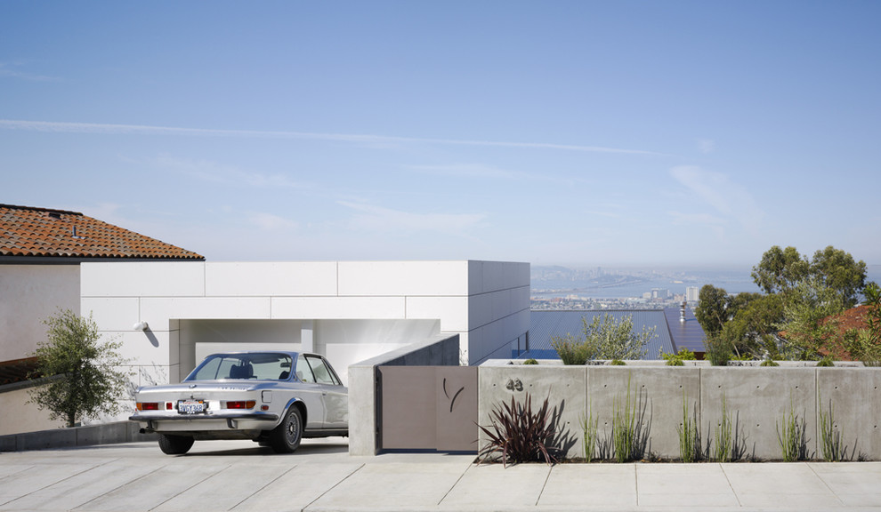 На фото: гараж в стиле модернизм для двух машин с