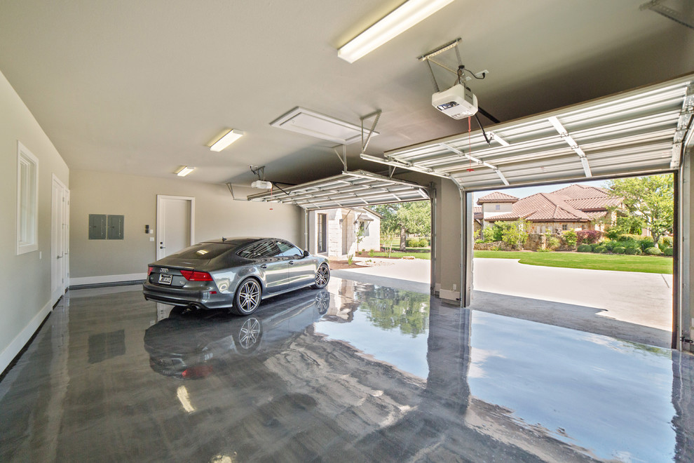 Ejemplo de garaje adosado contemporáneo grande para dos coches