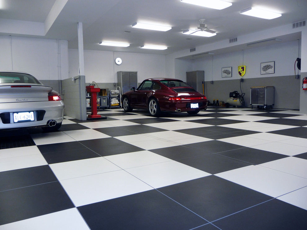 This is an example of a large modern attached garage in Birmingham with four or more cars.