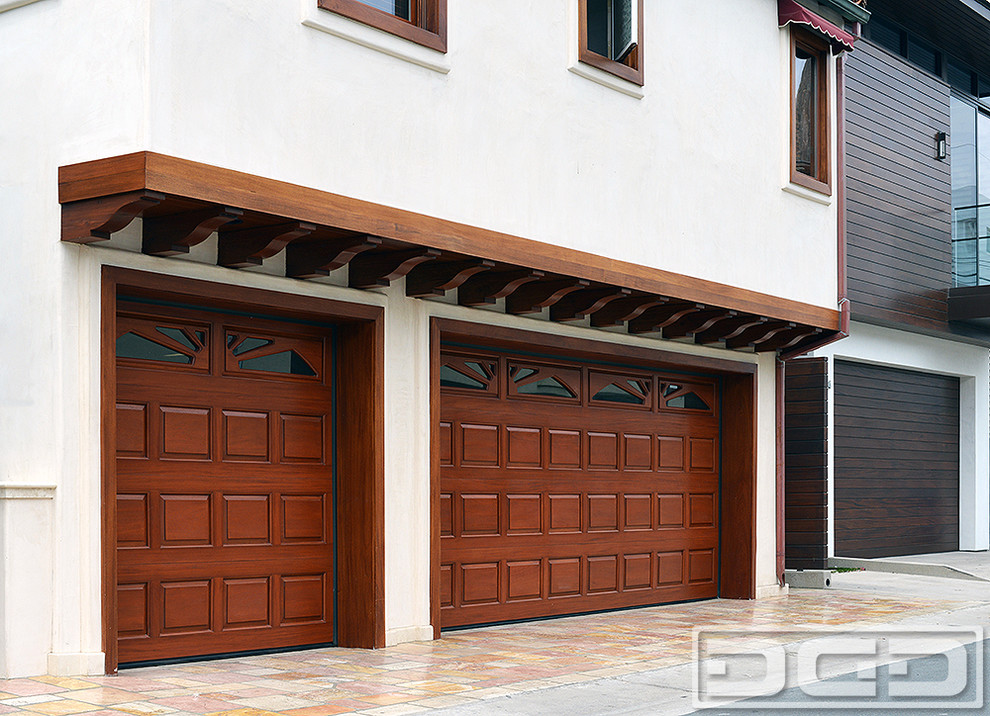 Mid-sized tuscan attached two-car garage photo in Los Angeles