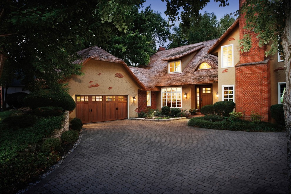 Inspiration for a mid-sized craftsman attached two-car garage remodel in Minneapolis