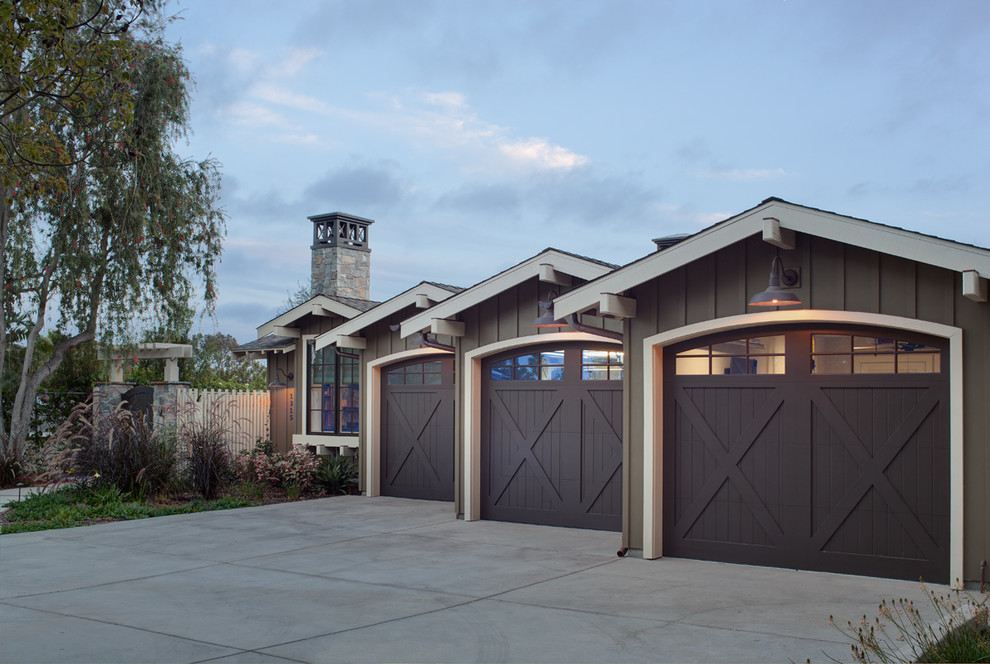 Inspiration for a farmhouse attached three-car garage remodel in San Diego