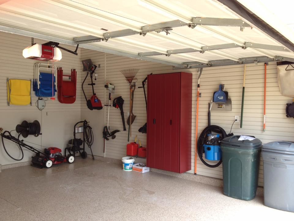 Inspiration for a medium sized classic attached double garage workshop in St Louis.