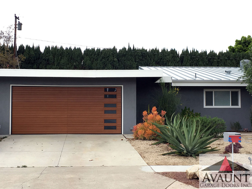 Example of a mid-sized trendy attached two-car garage design in Orange County