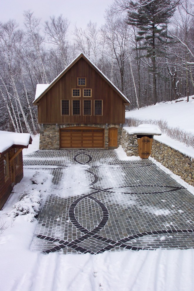 Example of a mountain style one-car garage design in Burlington