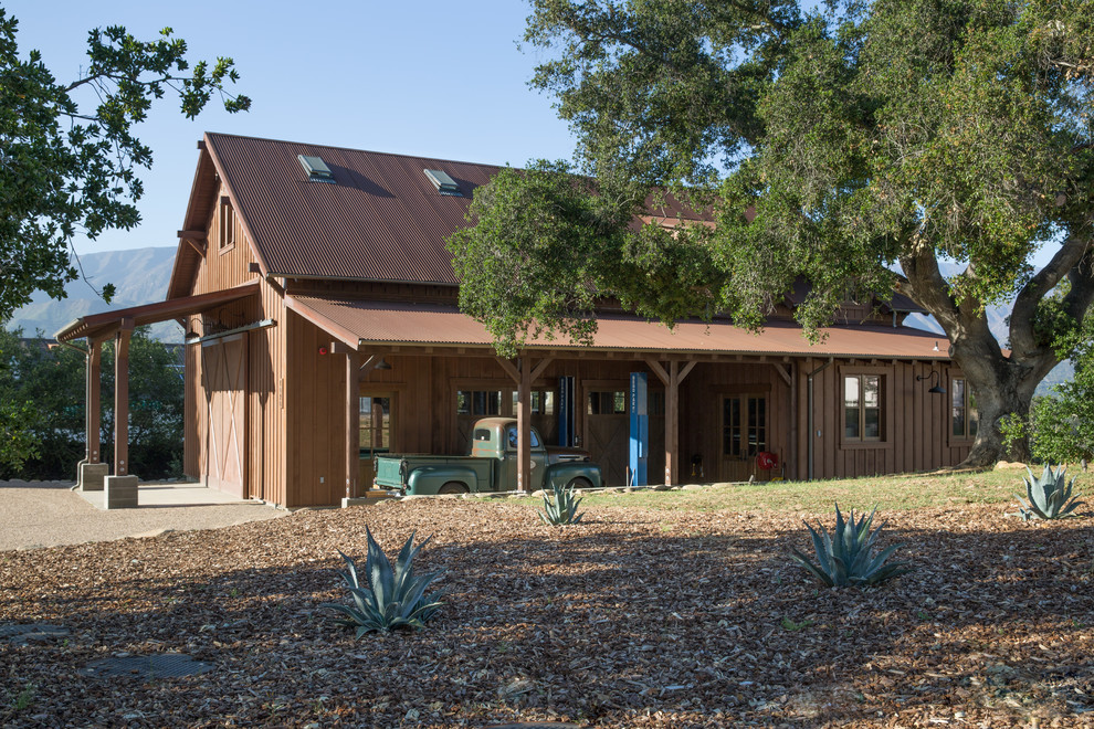 Example of a large cottage detached one-car garage design in Santa Barbara