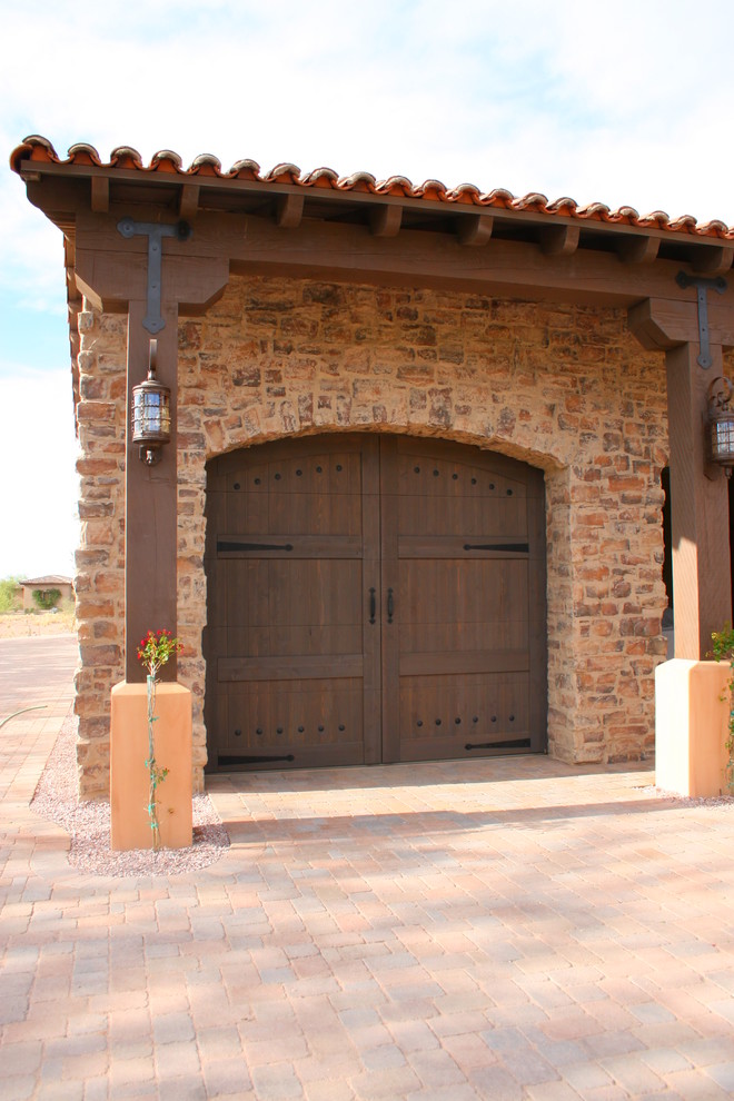 Inspiration for a medium sized rustic attached single carport in Phoenix.