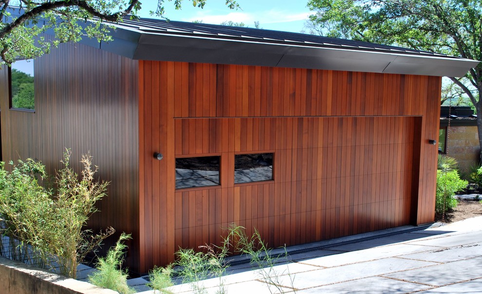 Design ideas for a large contemporary attached double garage in Austin.