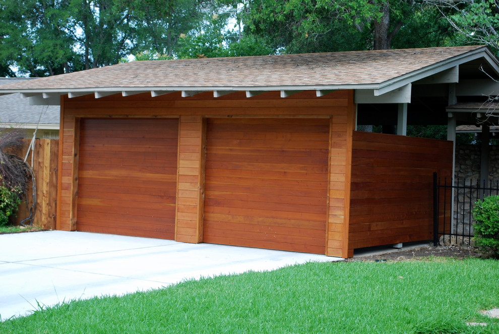 This is an example of a medium sized modern detached double garage in Austin.