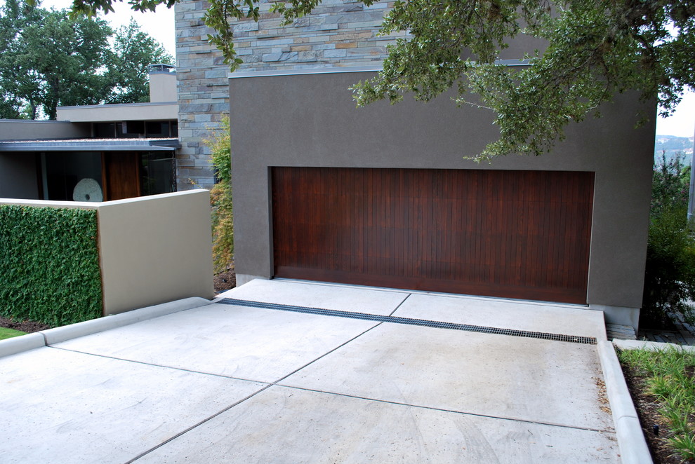 Photo of a large contemporary attached double garage in Austin.