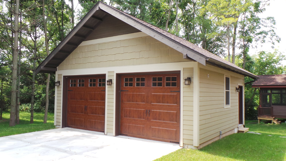 Large arts and crafts detached two-car garage photo in Other