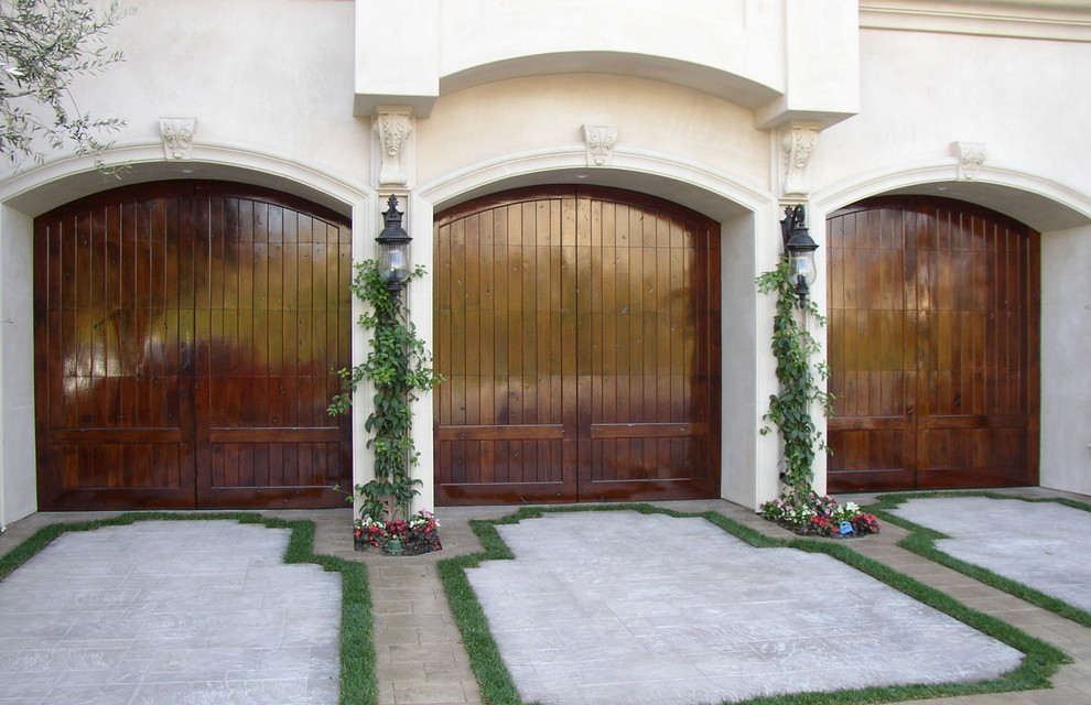 Mediterranean-style arched garage door stucco house