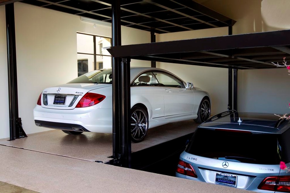 Custom car lift in California garage Contemporary Garage Los