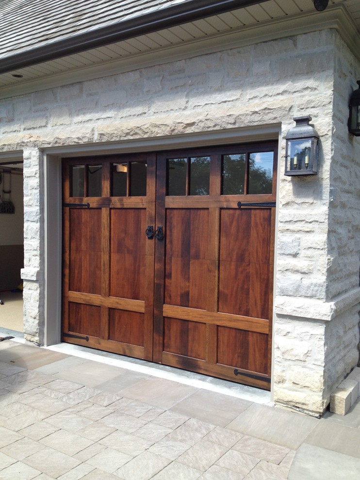 Example of an arts and crafts garage design in Toronto