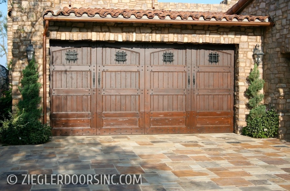Photo of a large mediterranean attached double garage in San Diego.