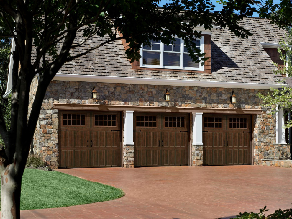 Photo of a medium sized traditional attached garage in Los Angeles with three or more cars.