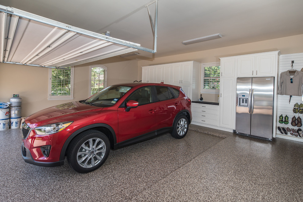 Design ideas for a large traditional garage in Houston with three or more cars.