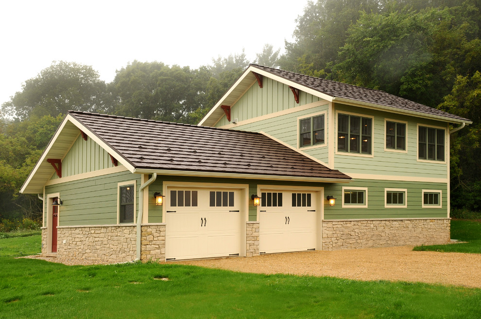 Example of a mid-sized arts and crafts detached two-car garage workshop design in Other