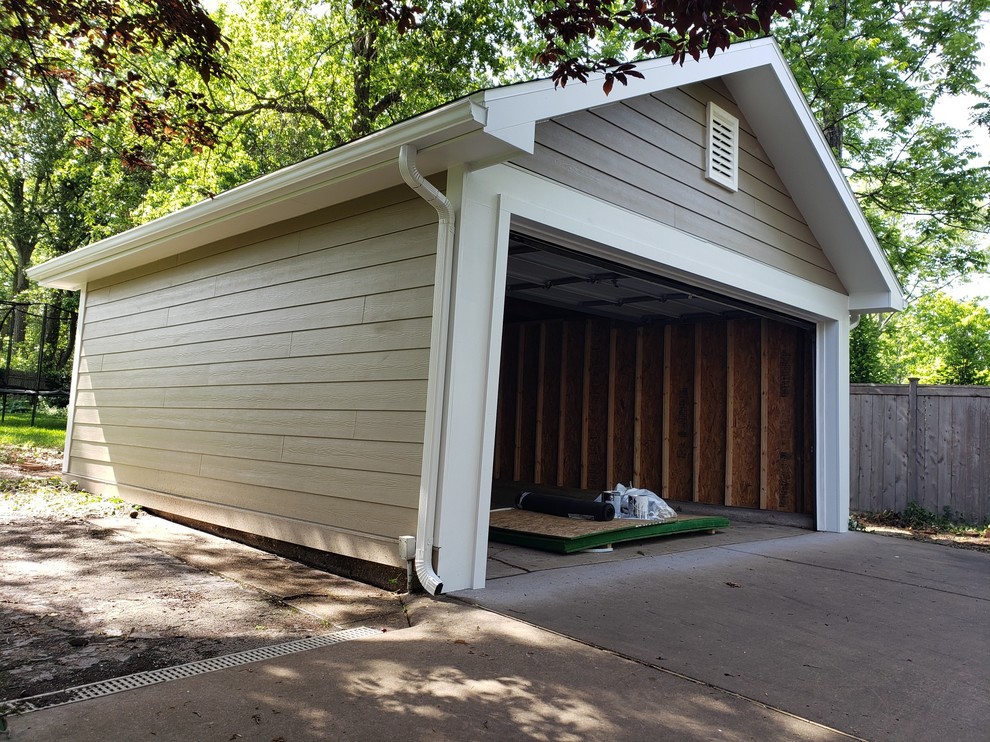 Inspiration pour un petit garage pour deux voitures séparé craftsman avec une porte cochère.