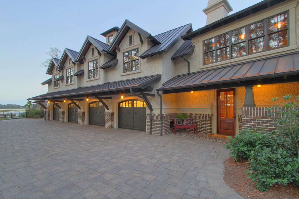 Photo of an expansive traditional attached garage in Atlanta with four or more cars.