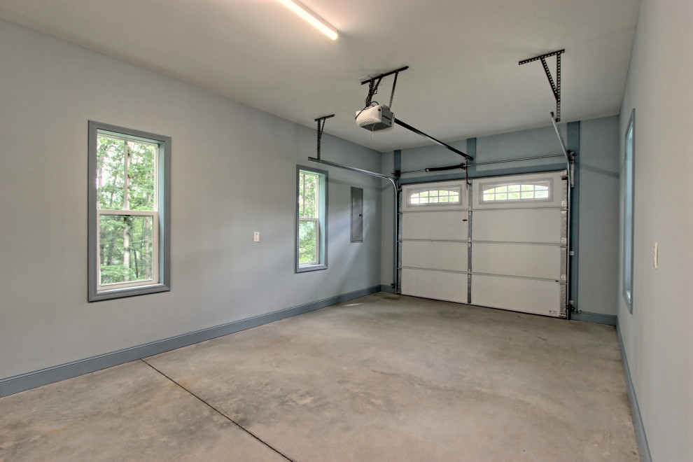 Example of a mid-sized eclectic attached one-car garage design in Atlanta