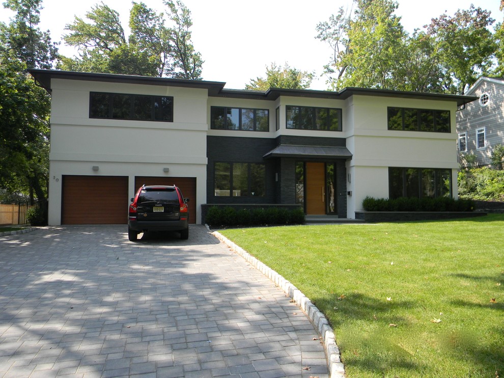 Example of a minimalist attached two-car garage design in New York