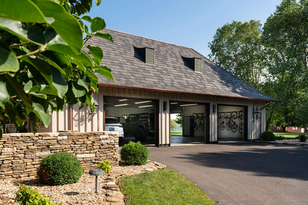 Photo of an expansive detached garage in Other with four or more cars.