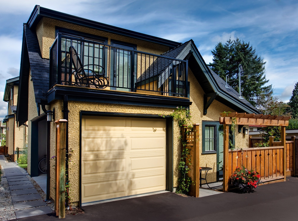 Garage - small traditional detached one-car garage idea in Vancouver