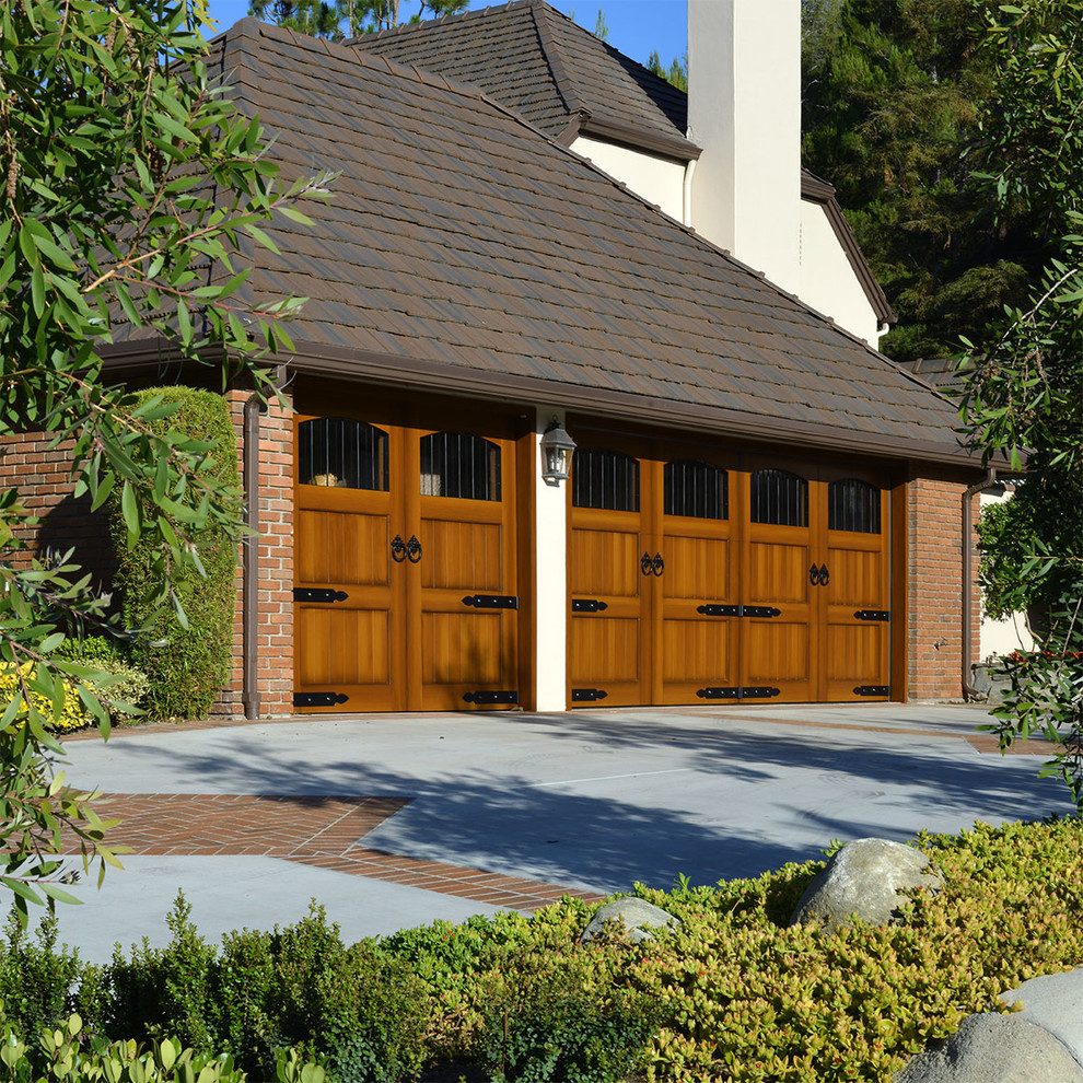 ECOFriendly Composite Garage Doors in a Custom European Style for a Tudor Home Traditional