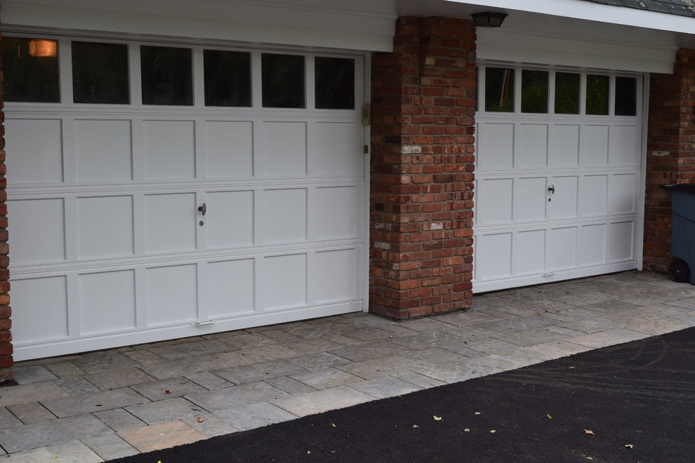 This is an example of a medium sized rustic attached double garage in New York.