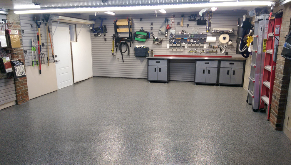 Etobicoke custom garage with epoxy floor, slat walls & cabinets ...