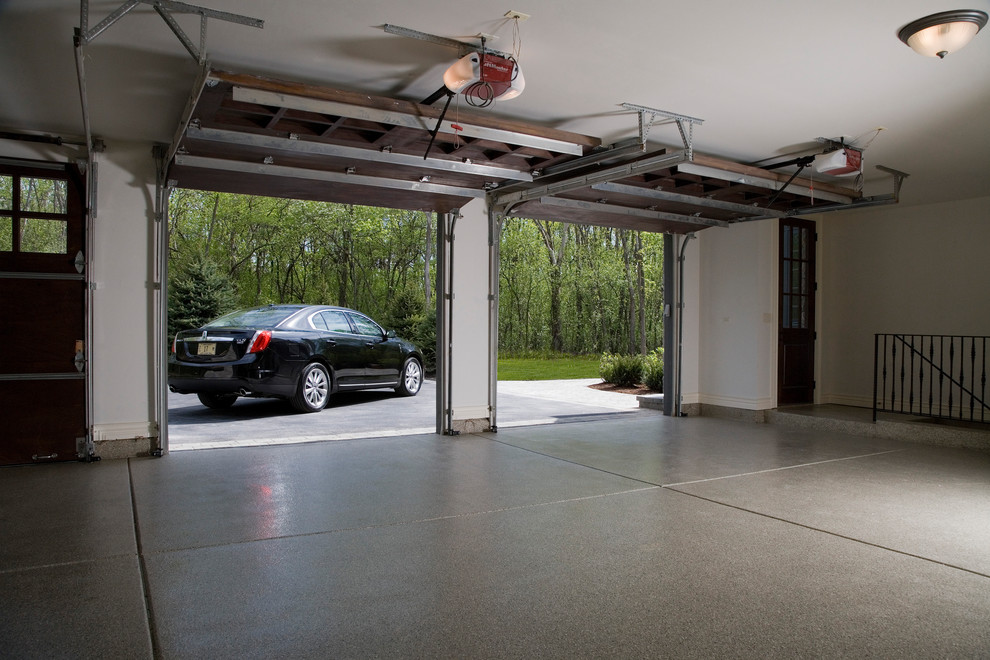 Design ideas for an expansive attached garage in Chicago with three or more cars.