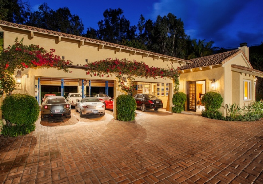 Design ideas for an expansive mediterranean detached carport in San Diego with four or more cars.